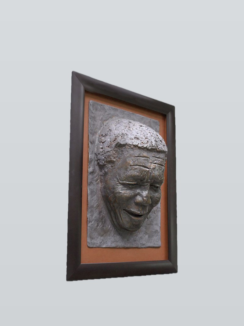 The multi-part mould of Mandela's face, framed by the artist. Wax was cast into this mould to make the positives that were then bronze-cast through the lost-wax process.