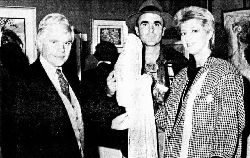 Kurt (centre) with *Tomorrow II*, a cloaked figure in malachite green holding a bowl, at his first Cape exhibition. Edrich's gallery, Stellenbosch, June 1990, opened by John Robert. *District Mail*, 15 June 1990.