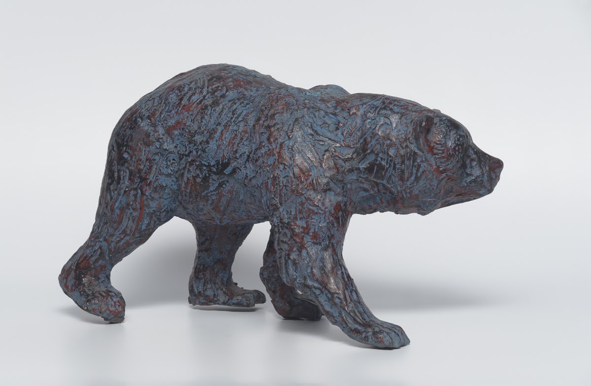 Bear — Walking bear, head thrust forward