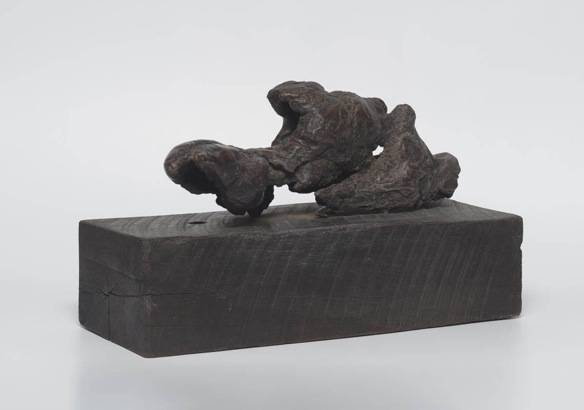 Fallen Torso — Fragmented bronze torso twisted in absence