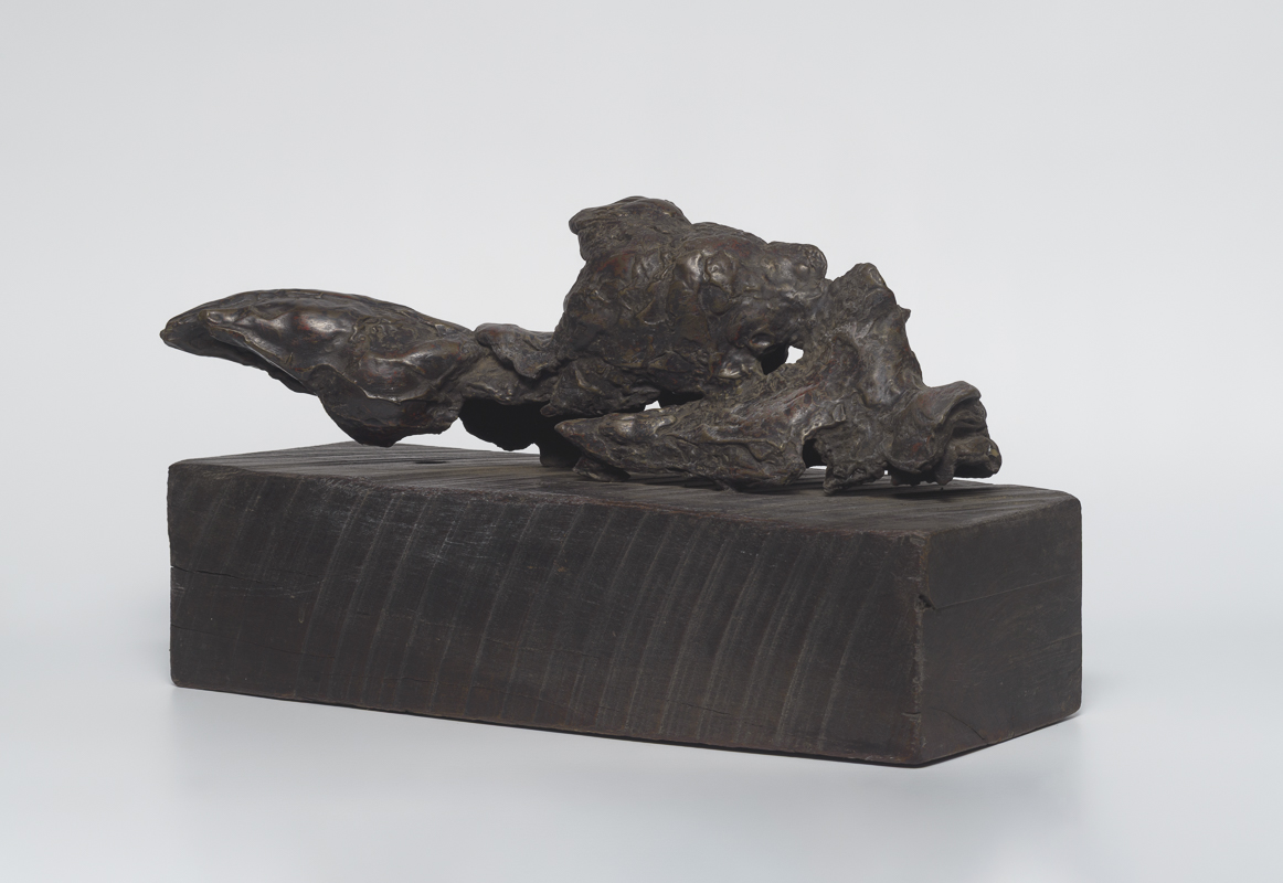 Fallen Torso — Fragmented bronze torso twisted in absence